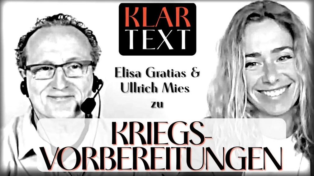 Bild: SS Video: "MANOVA Klartext zu Kriegsvorbereitungen Teil 1/2 (Ullrich Mies und Elisa Gratias) " (https://odysee.com/@Manova_Magazin:3/Klartext-zu-Kriegsvorbereitungen:a?src=embed&t=31.298208) / Eigenes Werk